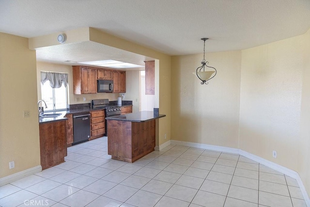 27474 Bolandra Ct, Temecula, CA 92591 - kitchen with black microwave, dark countertops, dishwashing machine, a peninsula, and brown cabinets