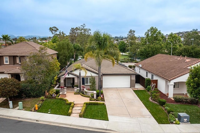 1064 Eliot St, Oceanside, CA 92057 - view of front facade featuring an attached garage, stucco siding, driveway, a tile roof, and a front lawn