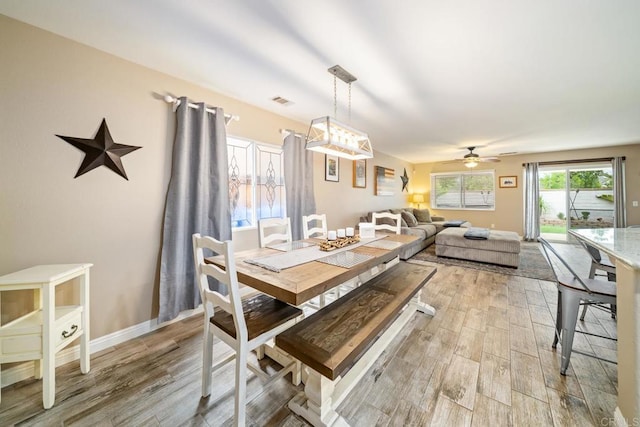 1064 Eliot St, Oceanside, CA 92057 - dining room with light wood-style floors and ceiling fan