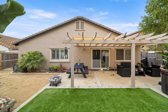 1064 Eliot St, Oceanside, CA 92057 - rear view of house with a fenced backyard, stucco siding, a pergola, and a patio area