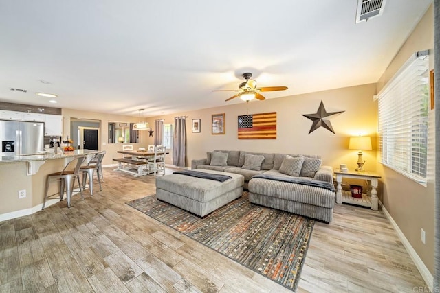 1064 Eliot St, Oceanside, CA 92057 - living area featuring light wood-style flooring and ceiling fan