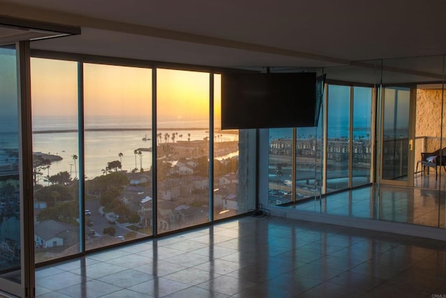 1200 N Harbor Dr Unit 15B, Oceanside, CA 92054 - tiled spare room featuring a wall of windows