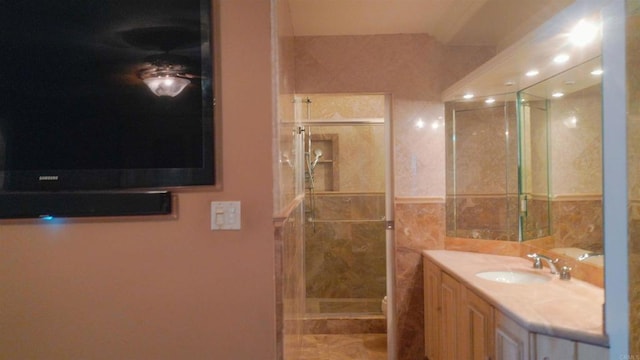 1200 N Harbor Dr Unit 15B, Oceanside, CA 92054 - full bath featuring vanity, a shower stall, and tile walls