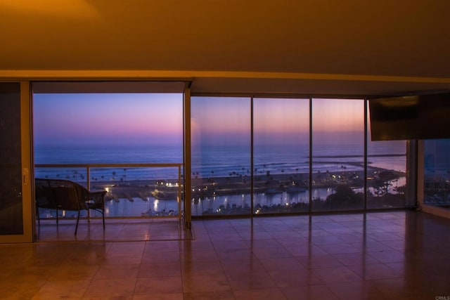 1200 N Harbor Dr Unit 15B, Oceanside, CA 92054 - tiled spare room featuring a water view