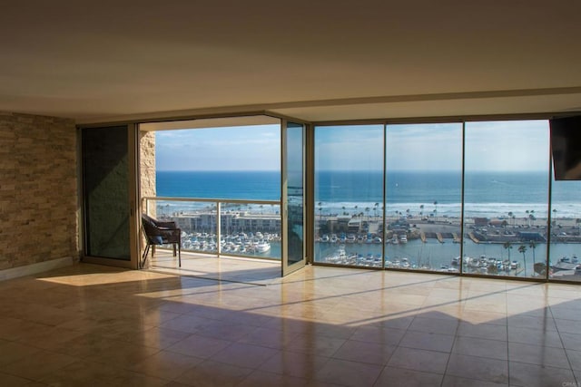 1200 N Harbor Dr Unit 15B, Oceanside, CA 92054 - empty room featuring view of marina, floor to ceiling windows, and tile patterned flooring