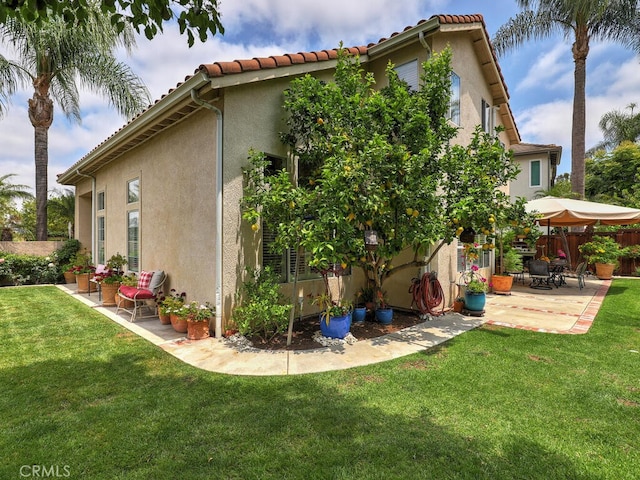 28 Covington, Mission Viejo, CA 92692 - view of side of property featuring a patio area, stucco siding, and a tile roof