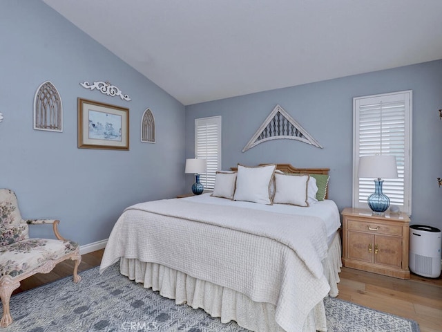 28 Covington, Mission Viejo, CA 92692 - bedroom featuring light wood finished floors and lofted ceiling