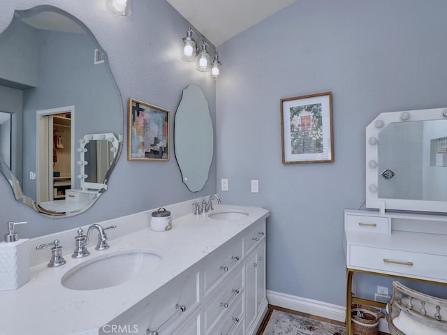 28 Covington, Mission Viejo, CA 92692 - bathroom featuring double vanity and lofted ceiling