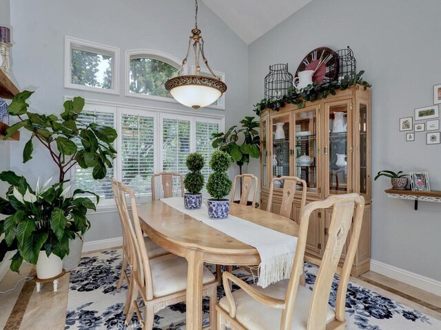 28 Covington, Mission Viejo, CA 92692 - dining space with baseboards and high vaulted ceiling