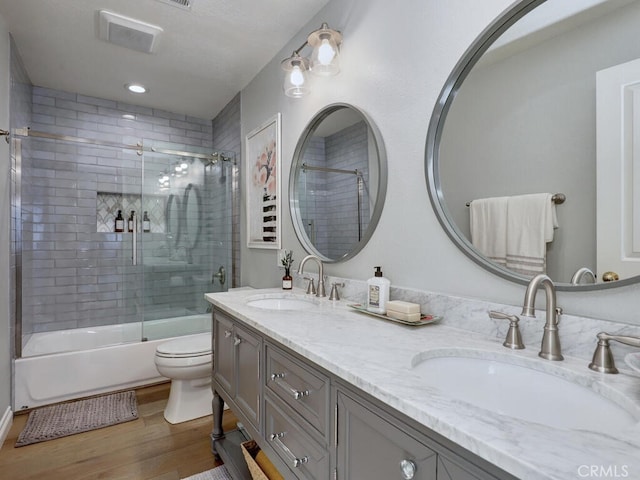 28 Covington, Mission Viejo, CA 92692 - full bathroom with wood finished floors, double vanity, and shower / bath combination with glass door