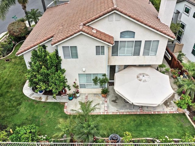 28 Covington, Mission Viejo, CA 92692 - back of property with a patio area, stucco siding, and a tiled roof