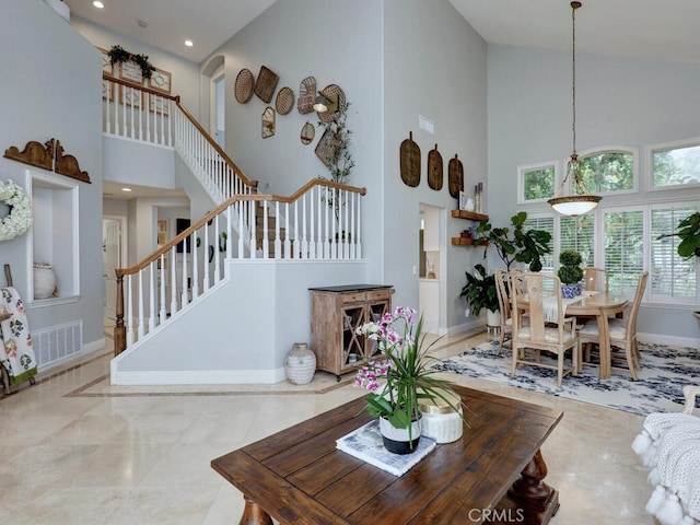 28 Covington, Mission Viejo, CA 92692 - living area featuring high vaulted ceiling, stairway, and recessed lighting