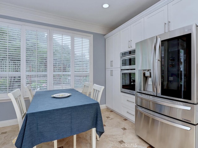 28 Covington, Mission Viejo, CA 92692 - kitchen featuring stainless steel appliances, plenty of natural light, white cabinetry, and ornamental molding