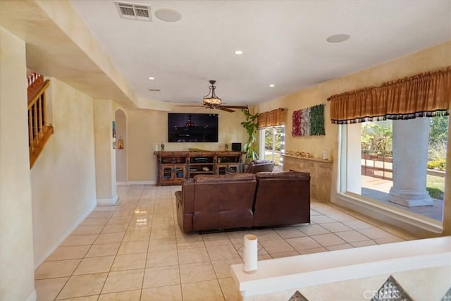 44037 Heaton Ave, Lancaster, CA 93534 - living room with arched walkways, a ceiling fan, light tile patterned flooring, baseboards, and recessed lighting