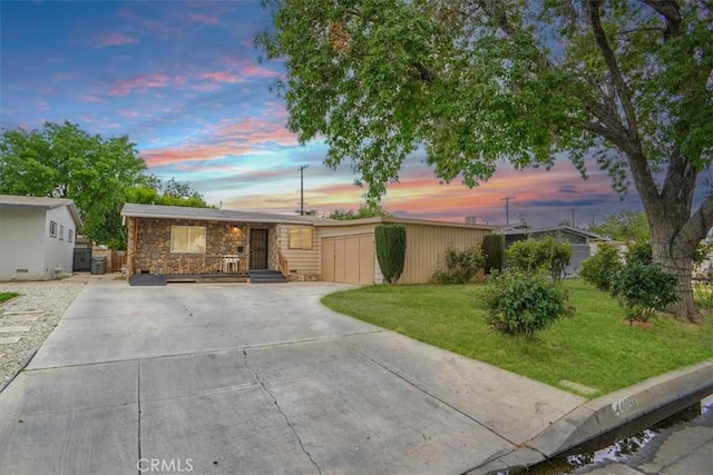44037 Heaton Ave, Lancaster, CA 93534 - view of front of house with driveway, stone siding, and a front lawn