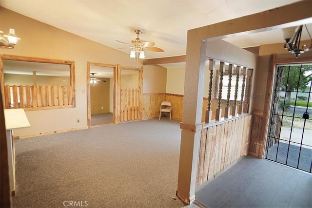 44037 Heaton Ave, Lancaster, CA 93534 - foyer entrance featuring wainscoting, wood walls, a ceiling fan, lofted ceiling, and wood finished floors