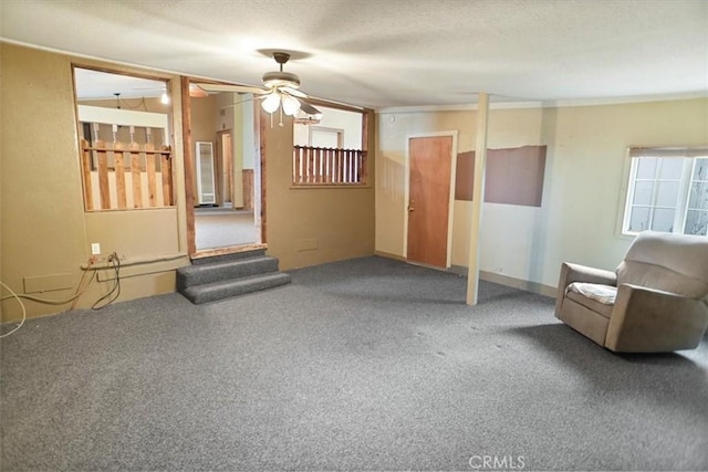 44037 Heaton Ave, Lancaster, CA 93534 - unfurnished living room with carpet, a ceiling fan, and a textured ceiling