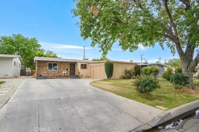 44037 Heaton Ave, Lancaster, CA 93534 - single story home with stone siding, driveway, and a front yard
