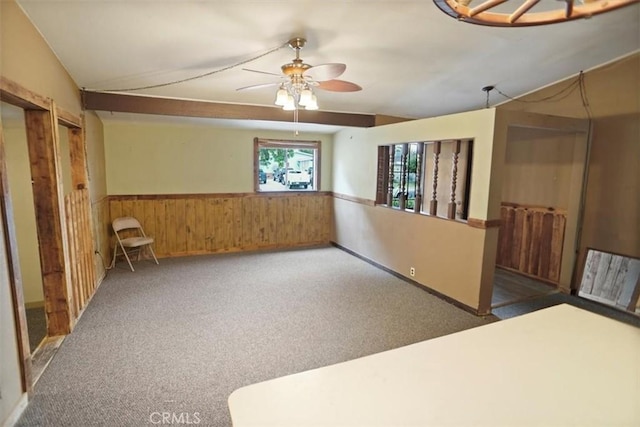 44037 Heaton Ave, Lancaster, CA 93534 - unfurnished room featuring wainscoting, ceiling fan, wooden walls, and carpet floors