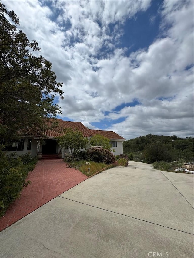 19605 Carancho Rd, Temecula, CA 92590 - view of front of home with a tile roof and stucco siding