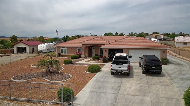 7912 Royce Ave, Hesperia, CA 92345 - view of front of property with driveway, an attached garage, a tile roof, and stucco siding