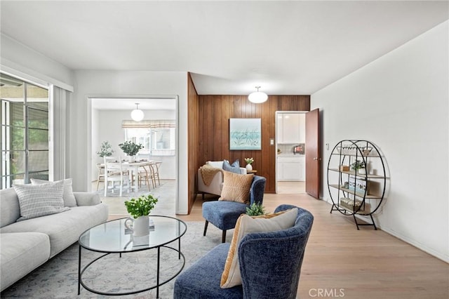 1139 W 149th St, Gardena, CA 90247 - living room with plenty of natural light, light wood finished floors, and baseboards