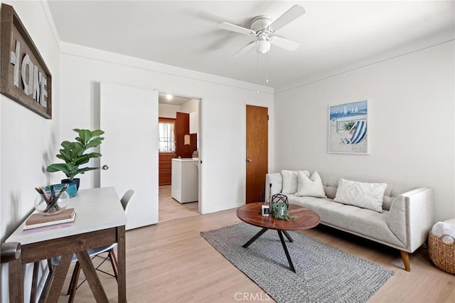 1139 W 149th St, Gardena, CA 90247 - living area with washer / clothes dryer, light wood finished floors, and ceiling fan