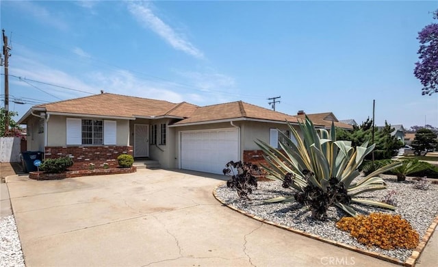 1139 W 149th St, Gardena, CA 90247 - single story home featuring stucco siding, an attached garage, driveway, brick siding, and roof with shingles