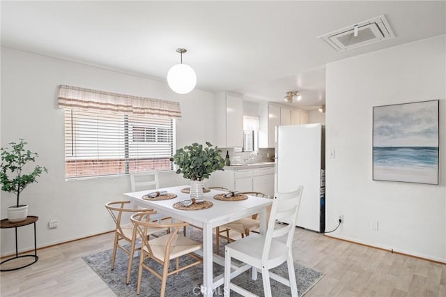 1139 W 149th St, Gardena, CA 90247 - dining space with light wood-type flooring