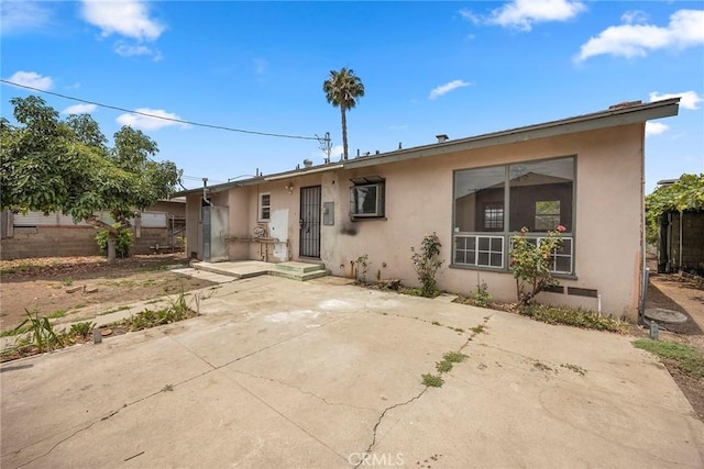 1208 E Commonwealth Ave, Fullerton, CA 92831 - view of front of home featuring stucco siding and a patio area