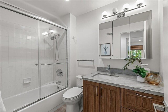 3995 Cypress Del Mar, San Diego, CA 92130 - full bathroom with vanity, toilet, and combined bath / shower with glass door