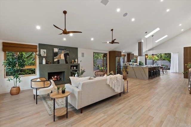 3995 Cypress Del Mar, San Diego, CA 92130 - living room with a ceiling fan, light wood finished floors, recessed lighting, a large fireplace, and high vaulted ceiling