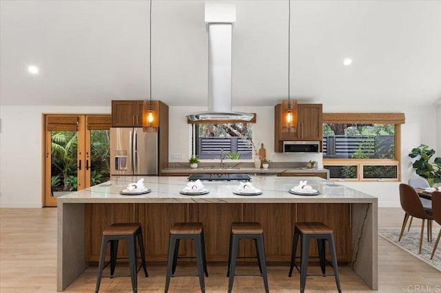 3995 Cypress Del Mar, San Diego, CA 92130 - kitchen with stainless steel appliances, island exhaust hood, a sink, pendant lighting, and a spacious island