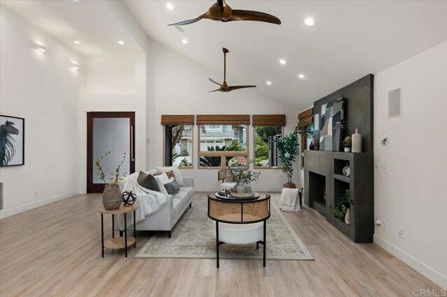 3995 Cypress Del Mar, San Diego, CA 92130 - living area featuring ceiling fan, recessed lighting, light wood finished floors, high vaulted ceiling, and baseboards