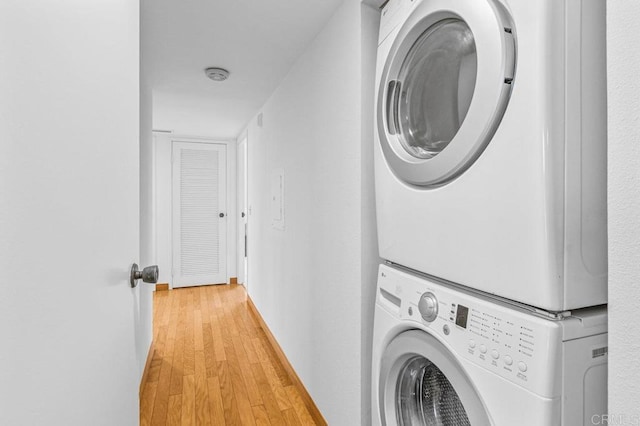 3635 7th Ave Unit 13E, San Diego, CA 92103 - laundry area with stacked washer / dryer and light wood-type flooring