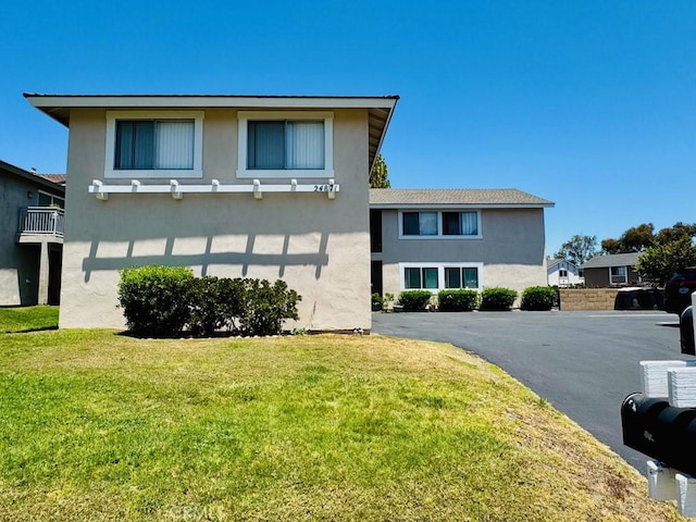 24871 Sherwood Way, Dana Point, CA 92629 - view of front of house featuring stucco siding and a front yard