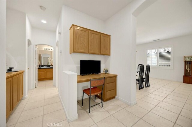 23820 Towish Dr, Corona, CA 92883 - office area featuring arched walkways and light tile patterned flooring