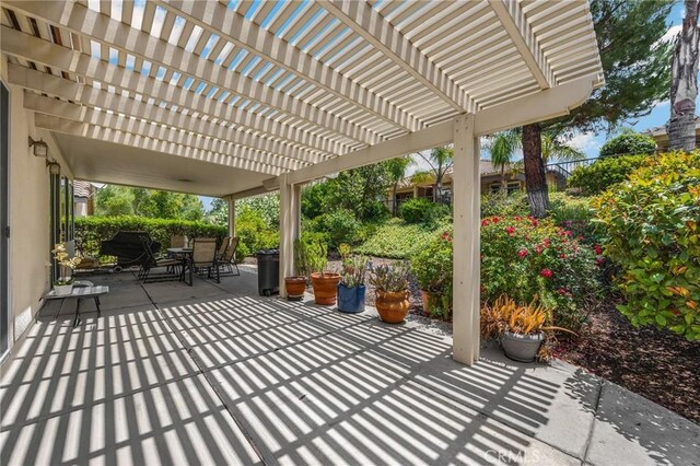 23820 Towish Dr, Corona, CA 92883 - view of patio featuring outdoor dining space and a pergola