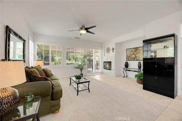23820 Towish Dr, Corona, CA 92883 - living area with ceiling fan, tile patterned flooring, and a tiled fireplace