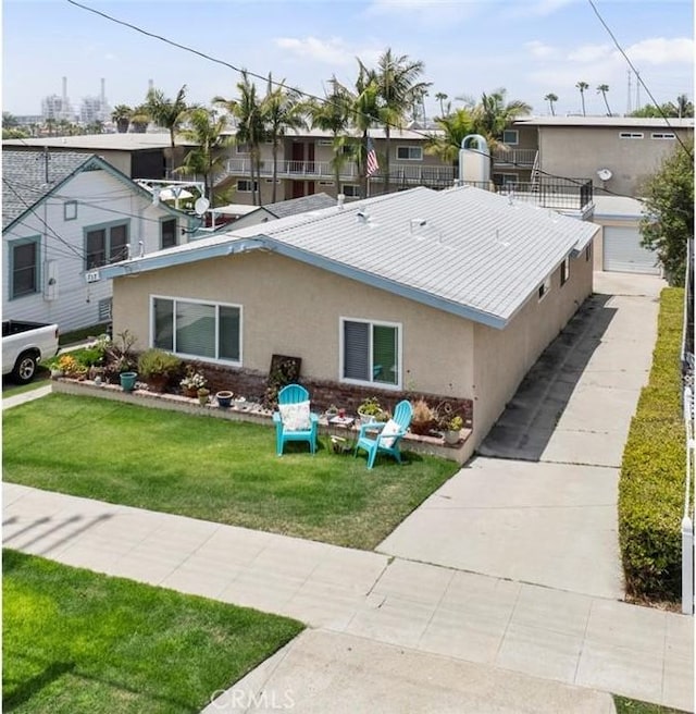 737 Carnelian St, Redondo Beach, CA 90277 - view of front of home featuring stucco siding, a front yard, and a garage
