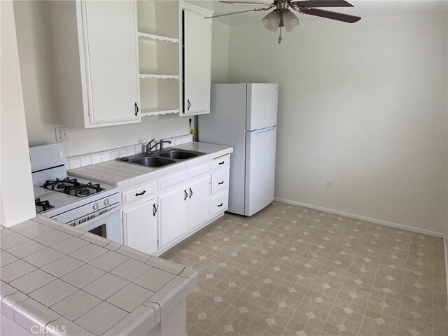 737 Carnelian St, Redondo Beach, CA 90277 - kitchen featuring white appliances, a sink, tile countertops, open shelves, and a ceiling fan