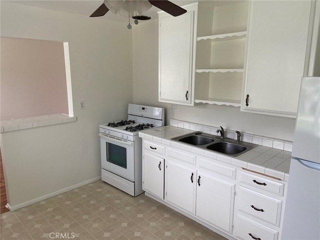 737 Carnelian St, Redondo Beach, CA 90277 - kitchen with white appliances, a sink, a ceiling fan, and white cabinets
