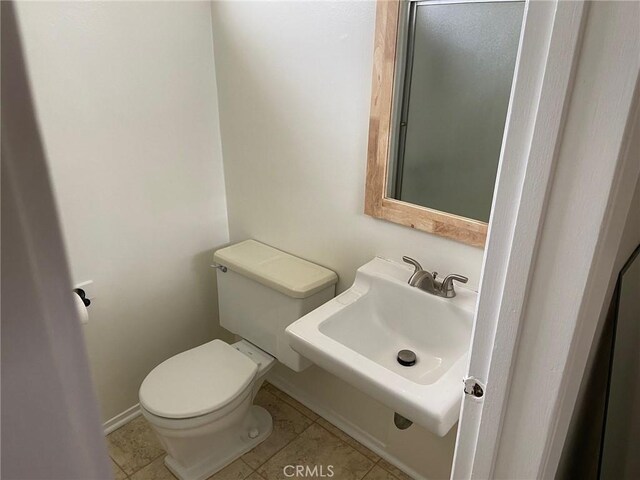 737 Carnelian St, Redondo Beach, CA 90277 - bathroom with toilet, baseboards, a sink, and tile patterned flooring