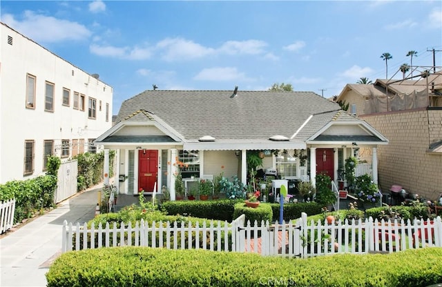 2756 W 15th St, Los Angeles, CA 90006 - view of front of home featuring a fenced front yard and covered porch