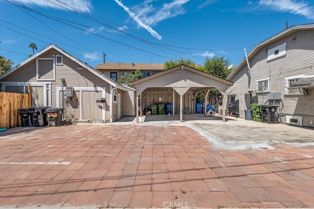 2756 W 15th St, Los Angeles, CA 90006 - rear view of property with a detached carport and an outdoor structure