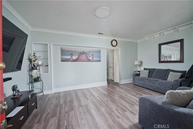 2756 W 15th St, Los Angeles, CA 90006 - living room featuring wood finished floors, ornamental molding, baseboards, and built in features