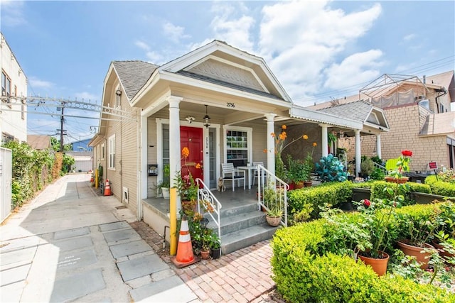 2756 W 15th St, Los Angeles, CA 90006 - view of front facade featuring covered porch and roof with shingles