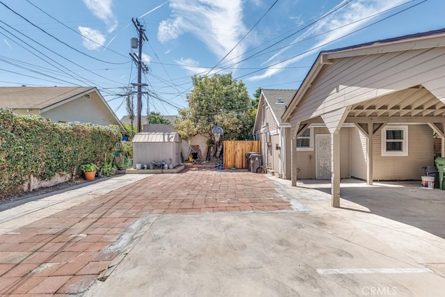 2756 W 15th St, Los Angeles, CA 90006 - view of patio featuring a carport and driveway