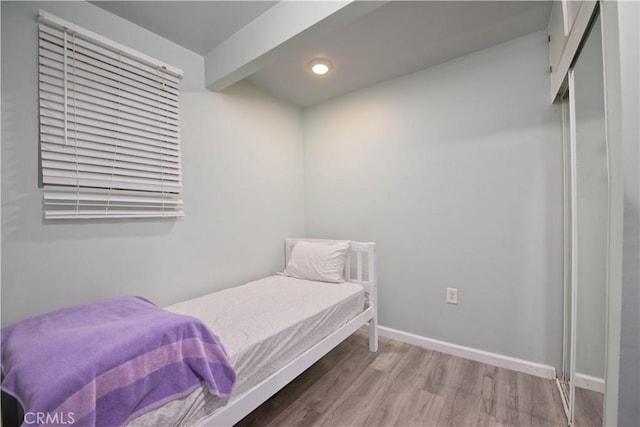 2756 W 15th St, Los Angeles, CA 90006 - bedroom featuring wood finished floors, baseboards, beam ceiling, and recessed lighting