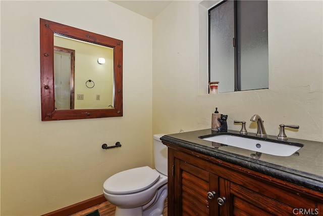 320 W Aeroplane Blvd, Big Bear City, CA 92314 - bathroom with toilet, vanity, and baseboards